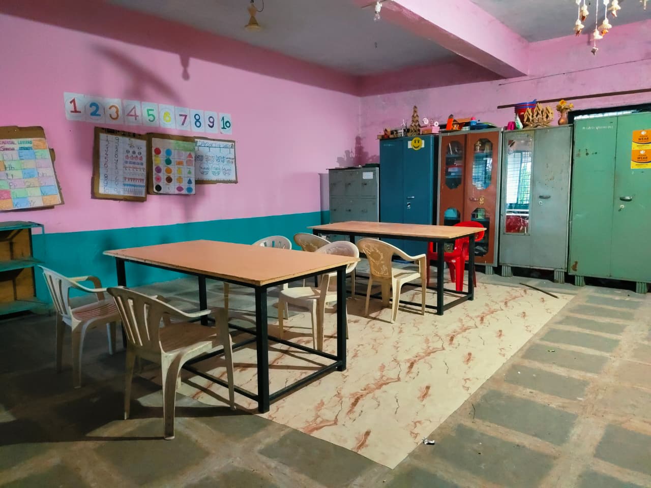 Teaching aids room with charts and learning materials